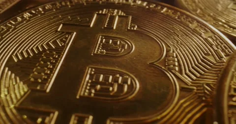 Macro probe lens flying over a stack of bitcoin. Stock Footage 170515799