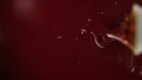 Macro process of pouring vegetable brown oil, slow motion. Stock Footage 277687919