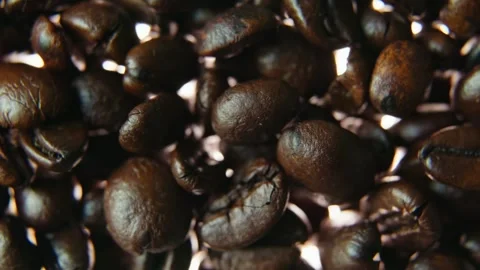 Macro Pull Back from Roasted Coffee Beans into Soft Cinematic Bokeh. Stock Footage 340028570