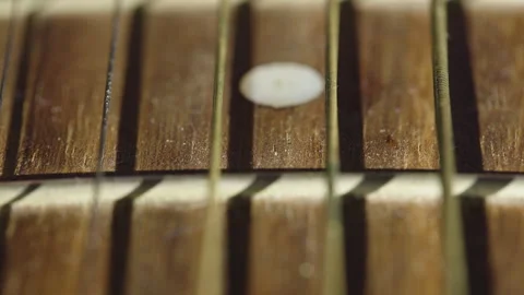 Macro Pull Focus Along Acoustic Guitar Strings And Fretboard Video stock 328581991