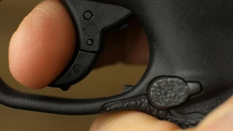 Macro - pulling a trigger on a handgun 스톡 동영상 89003507