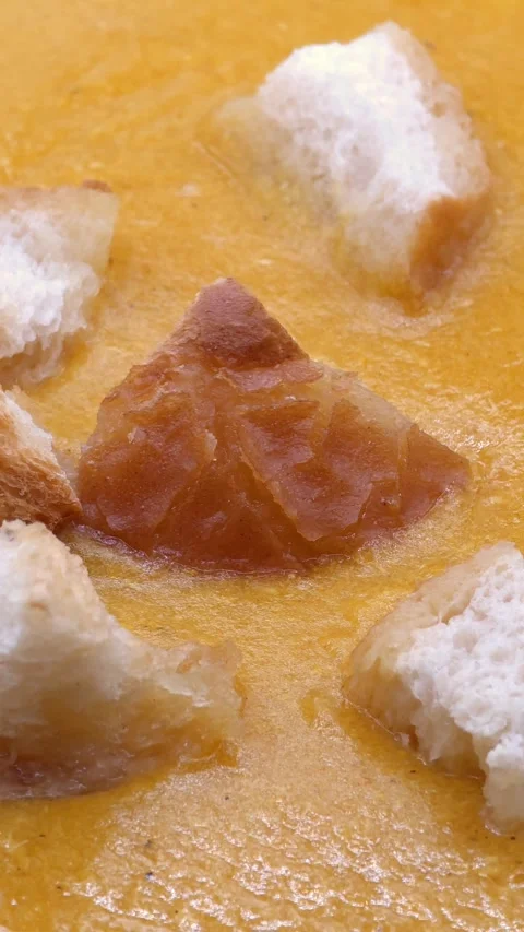 Macro pumpkin soup with croutons Video stock 327870504