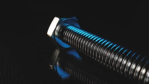 Macro push out shot of a bolt in a refle... | Stock Video | Pond5