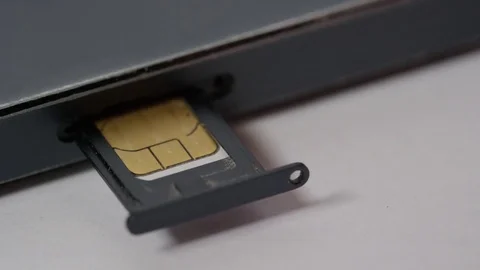 Macro putting sim card in phone Stock Footage 77938474