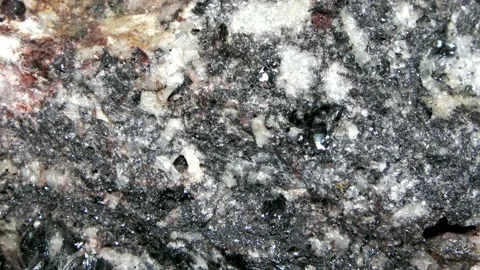 Macro of a quartz-biotite gneiss with quartzitic crystalline layers Stock Footage 167635363