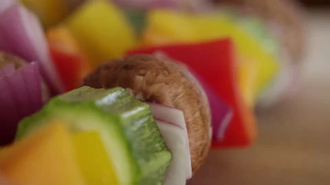 Macro rack focus shot of colorful vegetables on a skewer Video stock 153295783