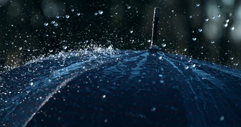 Macro of rain water drops falling with splash on umbrella while raining outside Stock Footage 269368646
