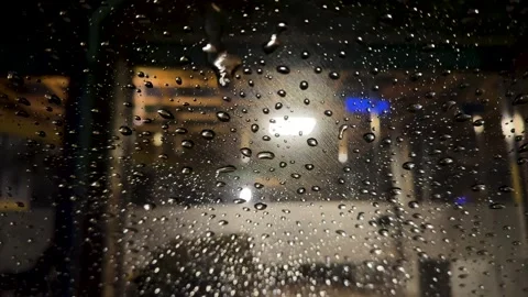 Macro raindrop on windshield at night. Stock Footage 326239557