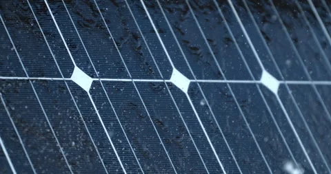 Macro of rainwater drops falling on solar panels at photovoltaic power plants Stock Footage 268234905