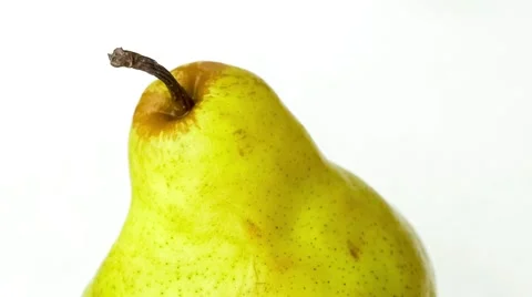 Macro of raw pear fruit with water flowing and splashing down from above in s Stock Footage 62794363