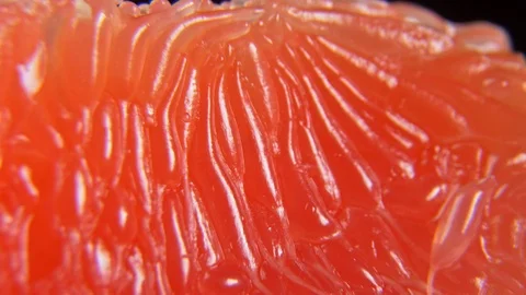 Macro of red juice grapefruit slice perfectly peeled Stock Footage 122256851