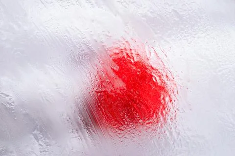 Macro red paint drop on white surface Japanese flag concept Stock Photos