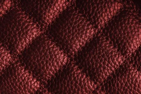 Macro of red quilted leather texture background with stitched pattern and s.. Stock Photos