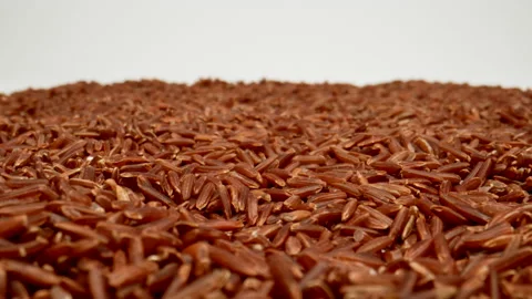 MACRO: Red rice grains on a white background. Dolly motion Stock Footage 166029412