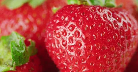Macro Red Strawberries Sprayed w/ Mist 2K Stock Footage 138541787