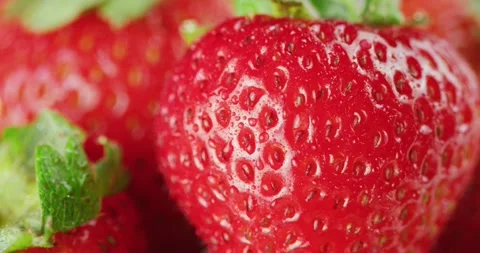 Macro Red Strawberries Sprayed w/ Mist 2K Stock Footage 138541828