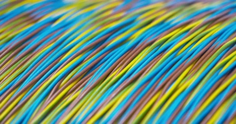 Macro of a reel of multicolored cable, rack focus and close up Stock Footage 154798535
