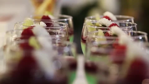 Macro Refocus Shot of Layered Mint Desserts with Berries in Glass Cups Stock Footage 327355570