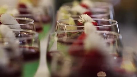 Macro Refocus Shot of Mint Dessert Cups with Raspberries in Elegant Glasses Stock Footage 327482379