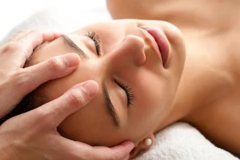 Macro relaxing facial massage. Stock Photos