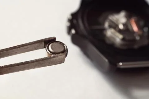 Macro of replacing a watch battery Foto stock