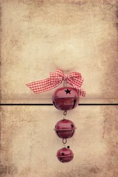 Macro retro cross processed effect image of christmas bells on wooden backgro Stock Photos