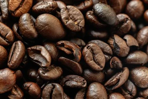 The macro of roasted coffee beans background, the texture pattern Stock Photos