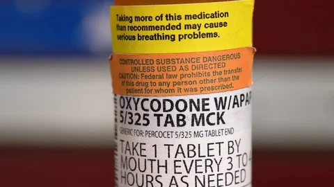 Macro rotate around oxycodone opioid tablet bottle Stock Footage