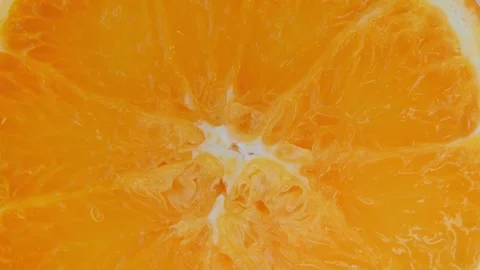 Macro Rotating Orange Citrus Surface Texture. Stockbeeldmateriaal 334575591