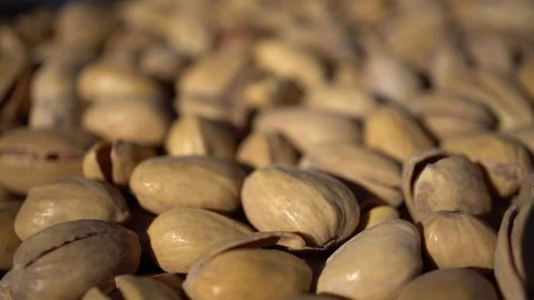 Macro of Rotating Pistachios Stock Footage 93837474