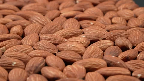 Macro Rotating Raw Almonds With Strong Backlight 4K Видео 332844768