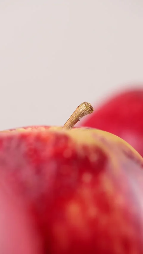 Macro of rotating red apple on the white background Stock Footage 290804413