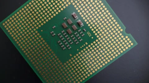 Macro rotating view of a CPU underside with gold contact grid, showing deta.. Stock Footage 322570421