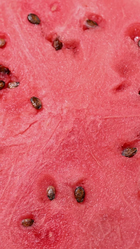 Macro rotating watermelon slice with juicy pulp and seeds. Stock Footage 315877736