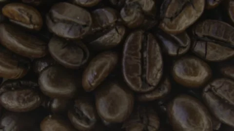 Macro Rotation of Coffee Beans and Soft Smoke. Stock Footage 334575697