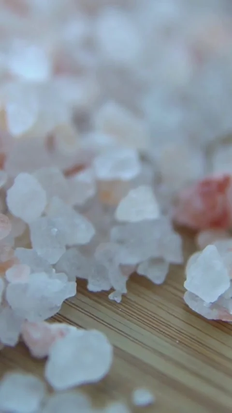 Macro rotation of pink himalayan rock salt crystals pile Video stock 334168515