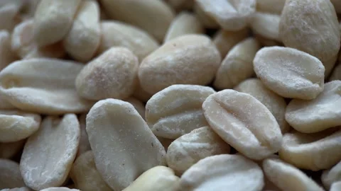 Macro Rotation Raw Shelled Peanuts Background Stock Footage 243523768