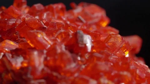 MACRO: Rough blood-red Ruby precious gemstone with stunning golden undertones Stock Footage 84592227