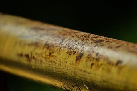 Macro of rusty iron walkway railing profile at night Stock Photos