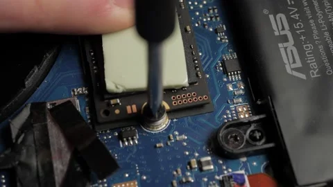 Macro Screwing in hard drive computer (1) Stock Footage 237027513