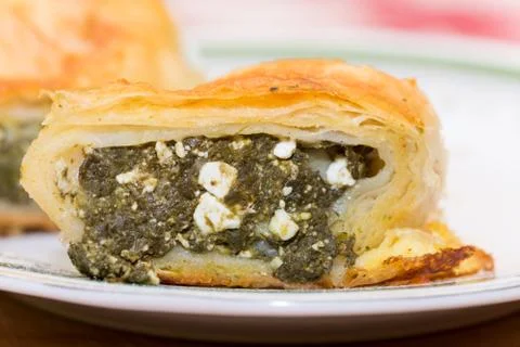 Macro selective focus spinach pie on the plate Stock Photos
