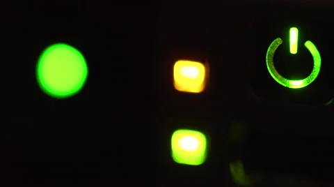 Macro of server lights blinking in a dim server room focus on power button 4k Stock Footage 60585280