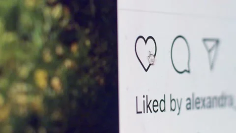 Macro shallow view of device screen with cursor clicking like button in Stock Footage 145741291