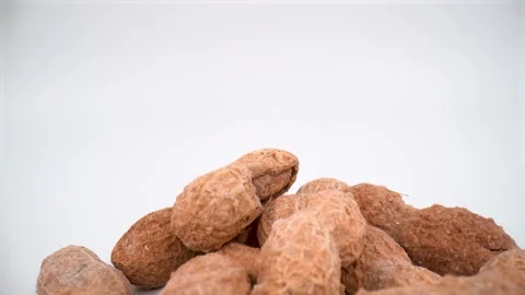Macro of shelled peanuts on white background isolated Stock Footage 328966546
