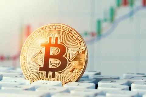 Macro shiny bitcoin on computer keyboard. virtual cryptocurrency concept Stock Photos