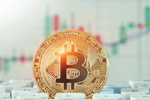 Macro shiny bitcoin on computer keyboard. virtual cryptocurrency concept Stock-Fotos