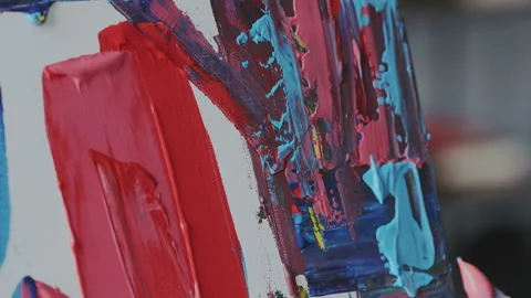Macro shoot of canvas texture with fresh acrylic colourful paints. Female hand Stock Footage 106135982