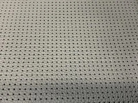A macro shoot of dark gray perforated artificial leather Stock Photos