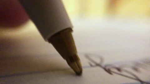Macro shoot of pen writing Stock Footage