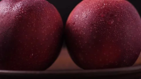 Macro shooting of apples with water drops. The camera moves in a panorama. large Stock Footage 186988098